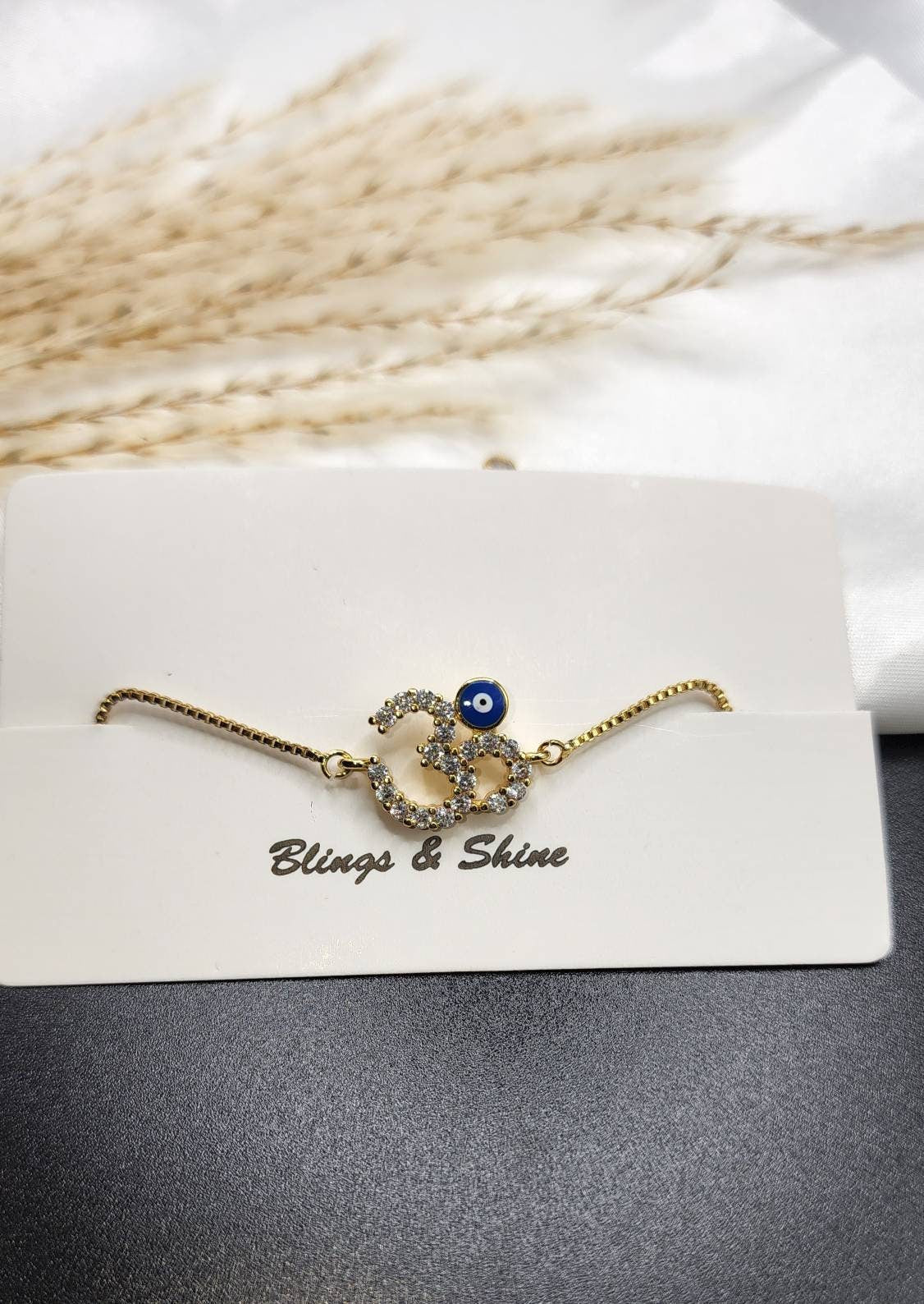 Om, evil eye Cz adjustable bracelet